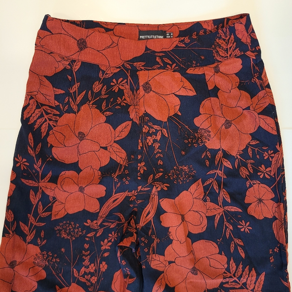 PrettyLittleThing Navy Rust Red Tropical Floral Print Flared Wide Leg Pants 4 - Picture 4 of 13